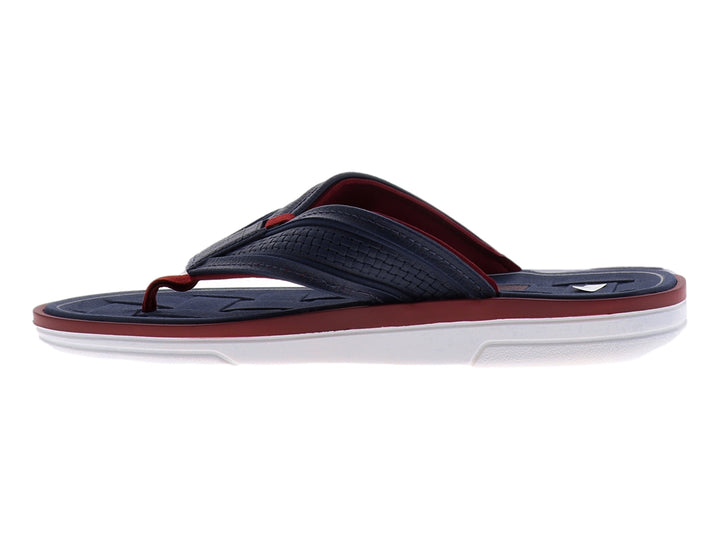 Sandalias Cartago color azul marino con suela blanca y detalles en rojo.