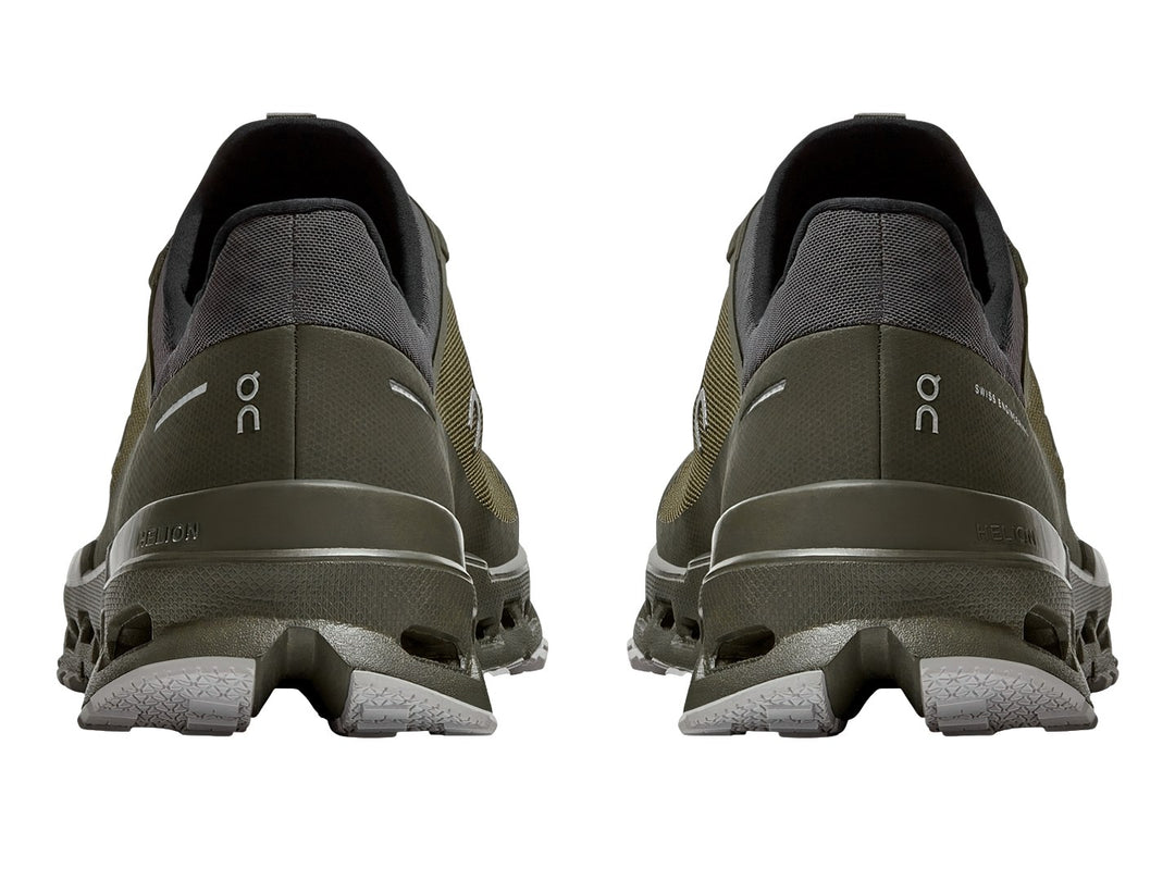 Tenis deportivos On Cloud Ultra color oliva y gris oscuro con suela para trail.