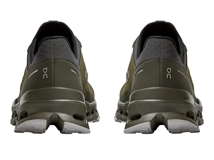 Tenis deportivos On Cloud Ultra color oliva y gris oscuro con suela para trail.
