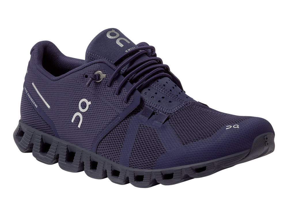 Tenis deportivos On Cloud color morado acai con suela amortiguada y tejido de malla.
