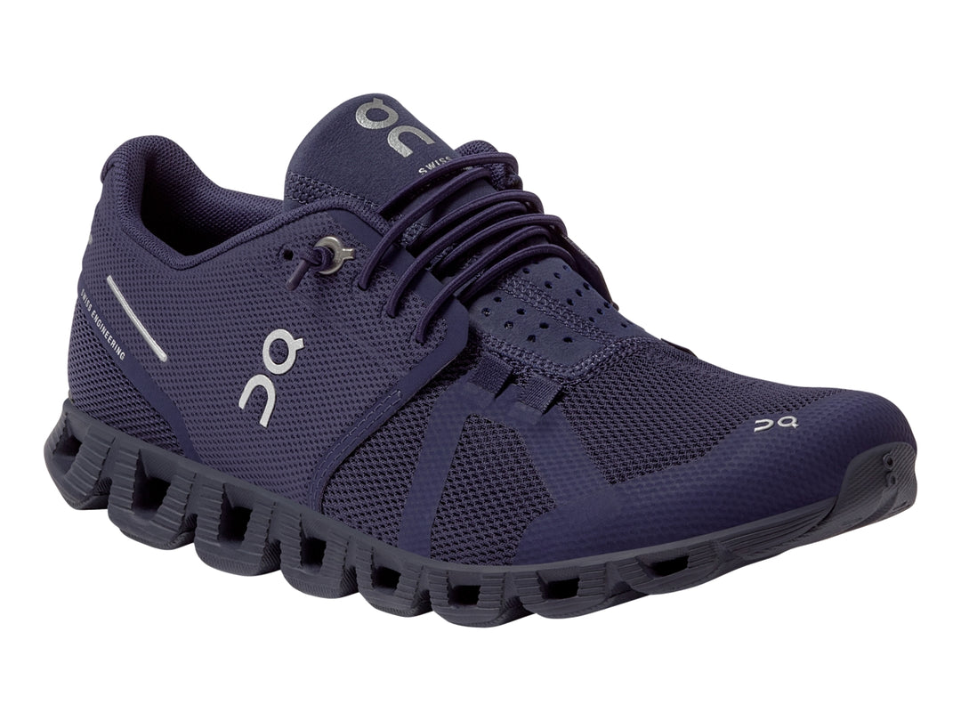 Tenis deportivos On Cloud color morado acai con suela amortiguada y tejido de malla.