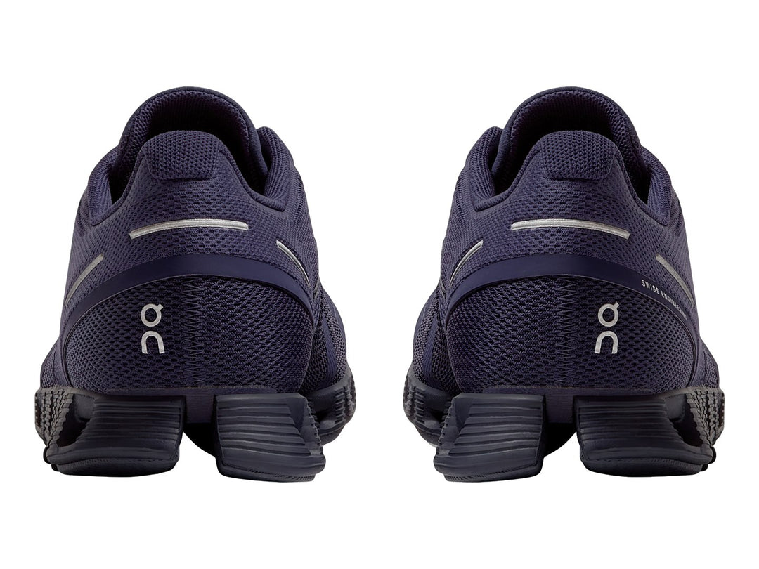Tenis deportivos On Cloud color morado acai con suela amortiguada y tejido de malla.