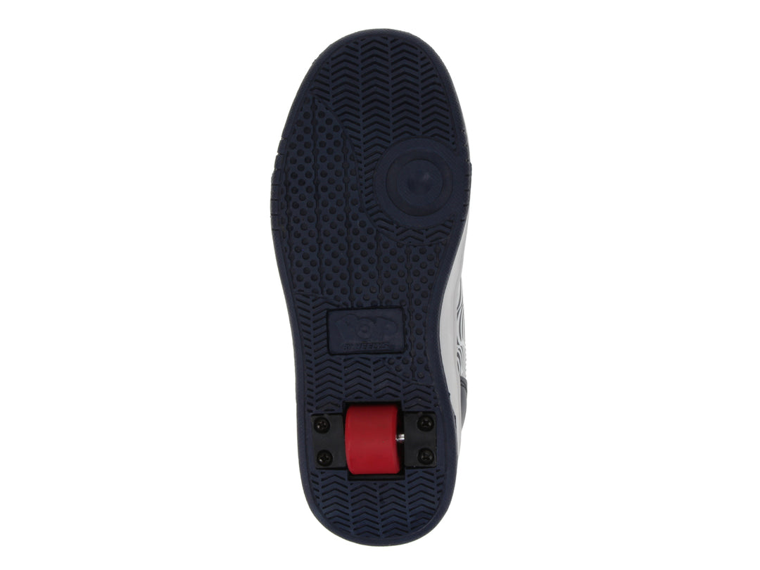 Tenis Heelys color azul marino con detalles en blanco y rojo, diseño gráfico lateral y suela blanca gruesa.