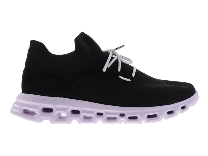 Tenis deportivos Dr House color negro con suela blanca gruesa y diseño tipo calcetín.