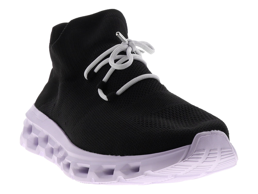 Tenis deportivos Dr House color negro con suela blanca gruesa y diseño tipo calcetín.