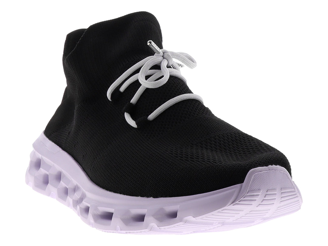 Tenis deportivos Dr House color negro con suela blanca gruesa y diseño tipo calcetín.