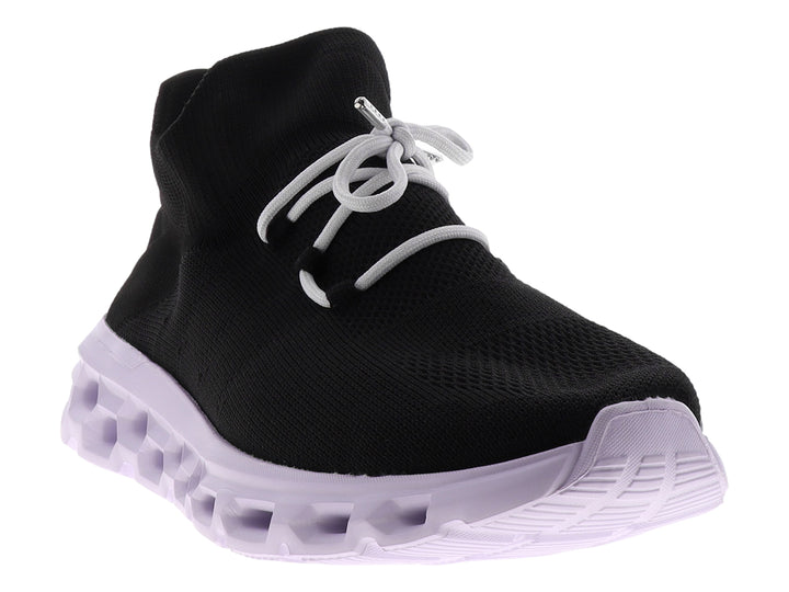 Tenis deportivos Dr House color negro con suela blanca gruesa y diseño tipo calcetín.