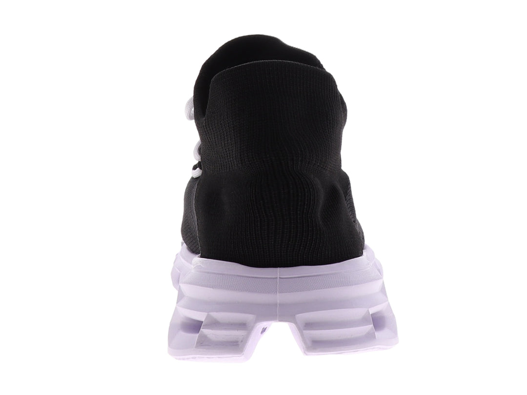 Tenis deportivos Dr House color negro con suela blanca gruesa y diseño tipo calcetín.