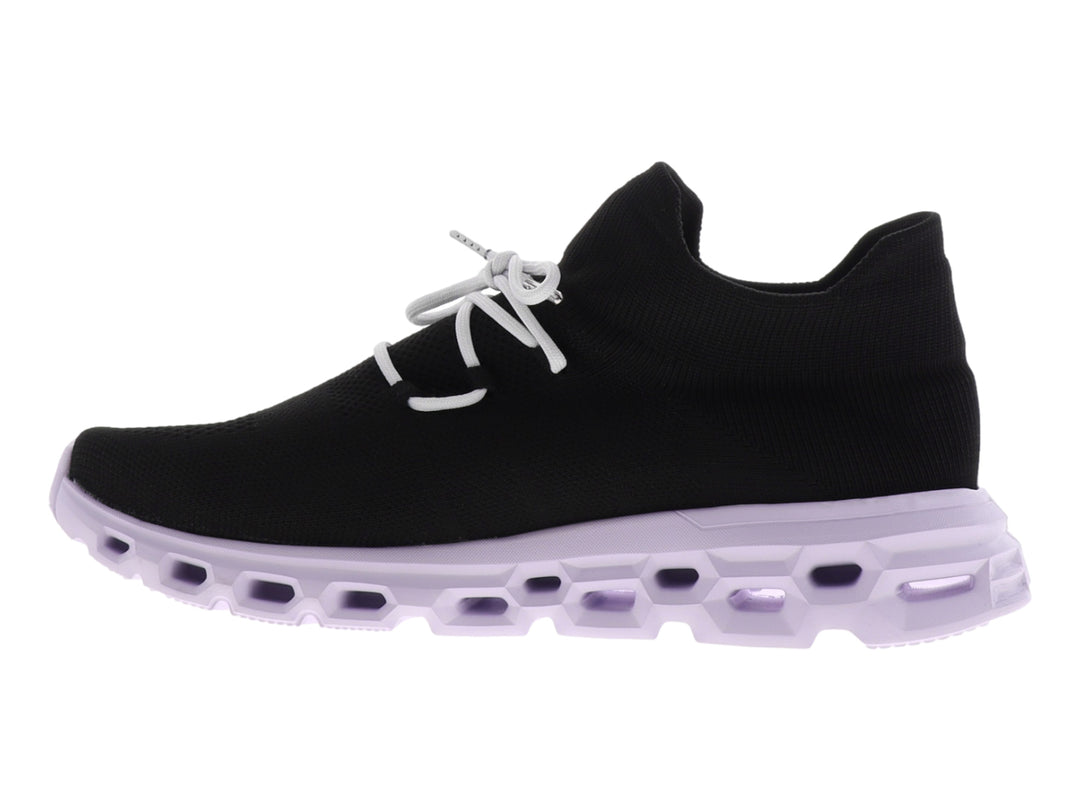 Tenis deportivos Dr House color negro con suela blanca gruesa y diseño tipo calcetín.