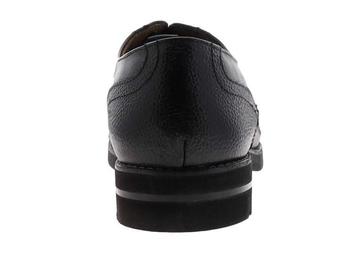 Zapato formal negro de cuero con agujetas y detalles perforados estilo brogue.