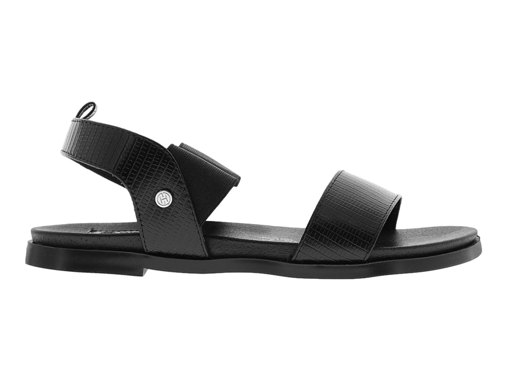 Sandalia Hispana color negro con correas anchas y suela plana para mujer.
