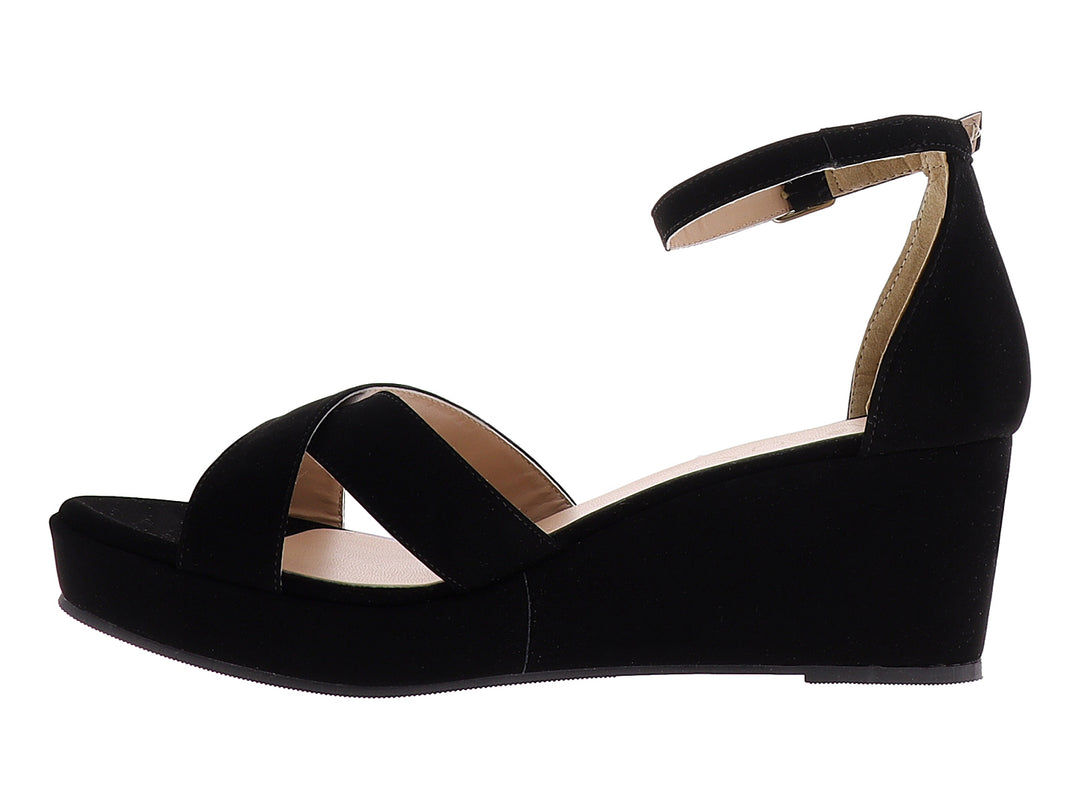 Sandalia de plataforma color negro con tiras cruzadas y correa ajustable al tobillo para mujer.
