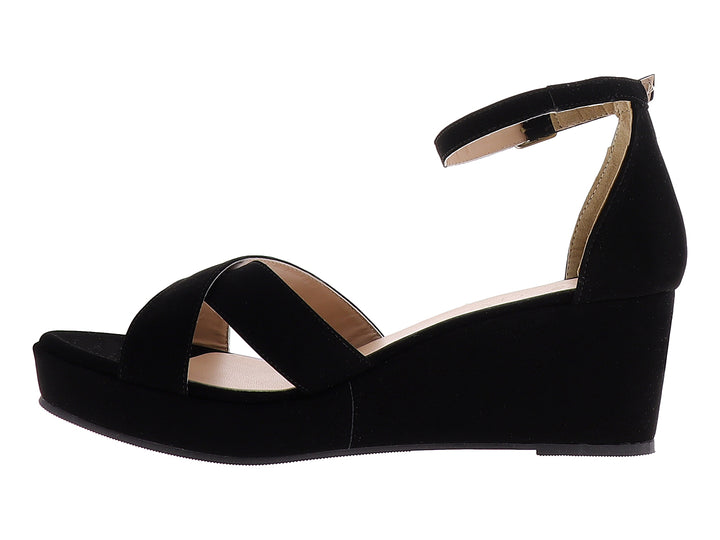Sandalia de plataforma color negro con tiras cruzadas y correa ajustable al tobillo para mujer.