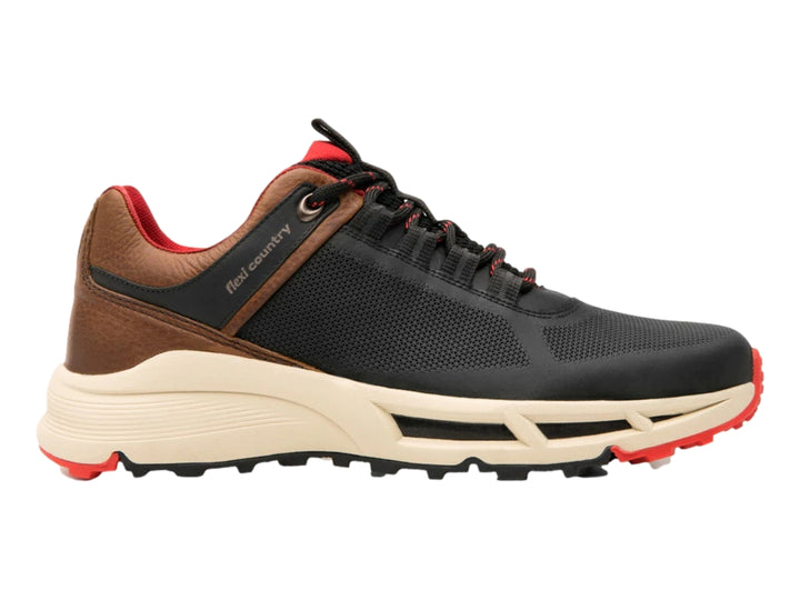 Zapato deportivo Flexi negro con detalles en café, suela blanca y acentos rojos.