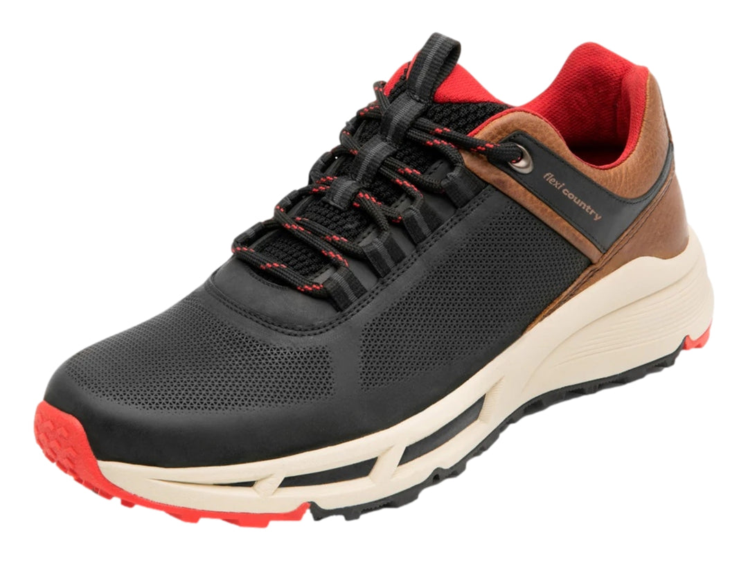 Zapato deportivo Flexi negro con detalles en café, suela blanca y acentos rojos.