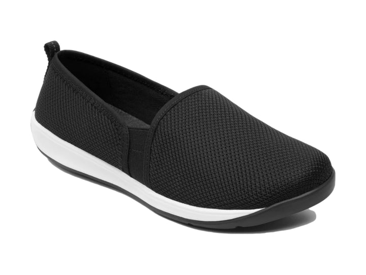 Zapato plano Flexi de color negro en textil con suela blanca, estilo slip-on casual.