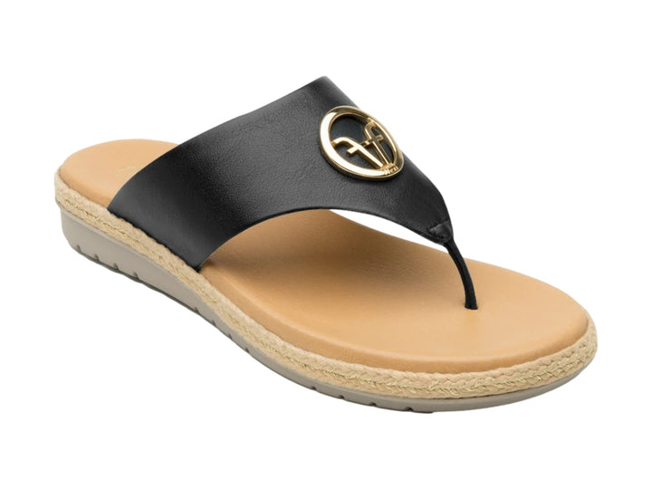 Sandalia Flexi para mujer en color negro con suela beige y detalle circular dorado en la tira.