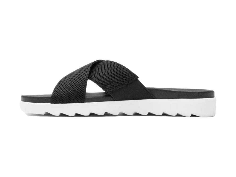 Sandalias Flexi negras de textil con correas cruzadas y suela blanca contrastante.