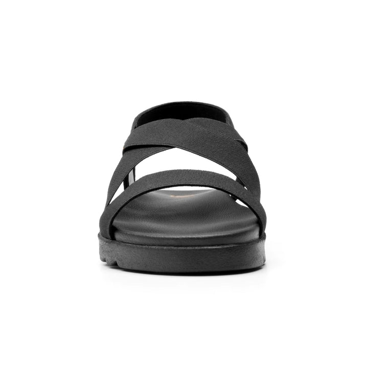 Sandalia negra de la marca Flexi con correas elásticas cruzadas y suela cómoda.