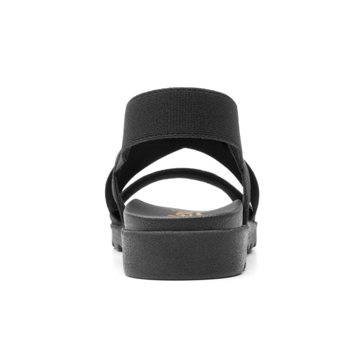 Sandalia negra de la marca Flexi con correas elásticas cruzadas y suela cómoda.