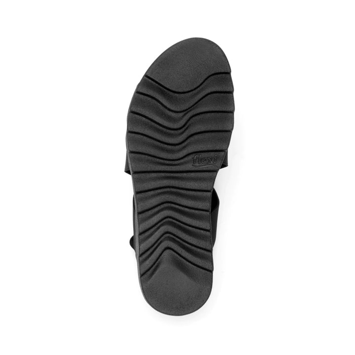Sandalia negra de la marca Flexi con correas elásticas cruzadas y suela cómoda.