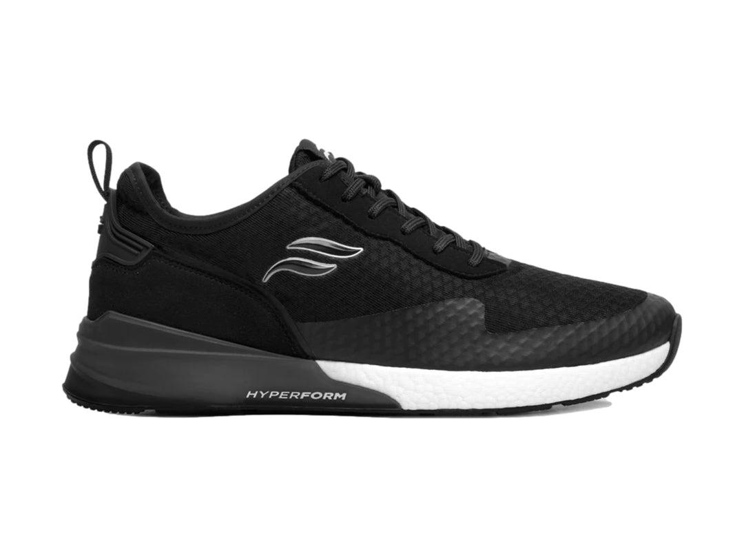 Tenis deportivos Flexi color negro con suela blanca y tejido de malla.