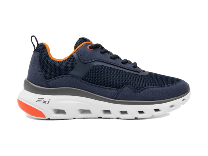 Tenis deportivos Flexi en color azul marino con suela blanca y detalles en naranja.