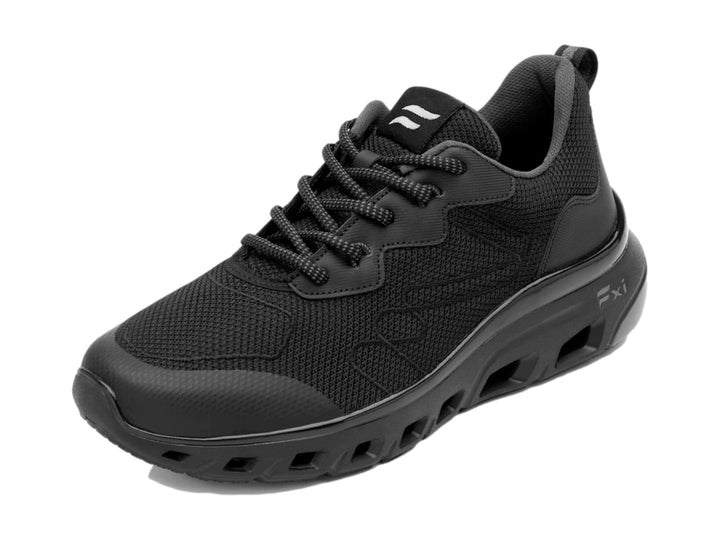 Tenis Flexi color negro con malla transpirable y suela gruesa deportiva.