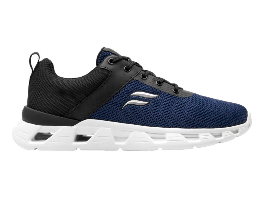 Tenis deportivos Flexi en color azul y negro con suela blanca gruesa y textura de malla.