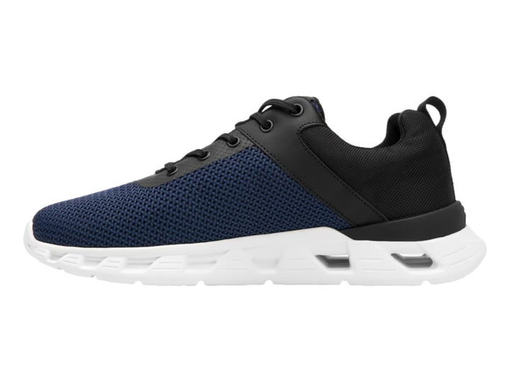 Tenis deportivos Flexi en color azul y negro con suela blanca gruesa y textura de malla.