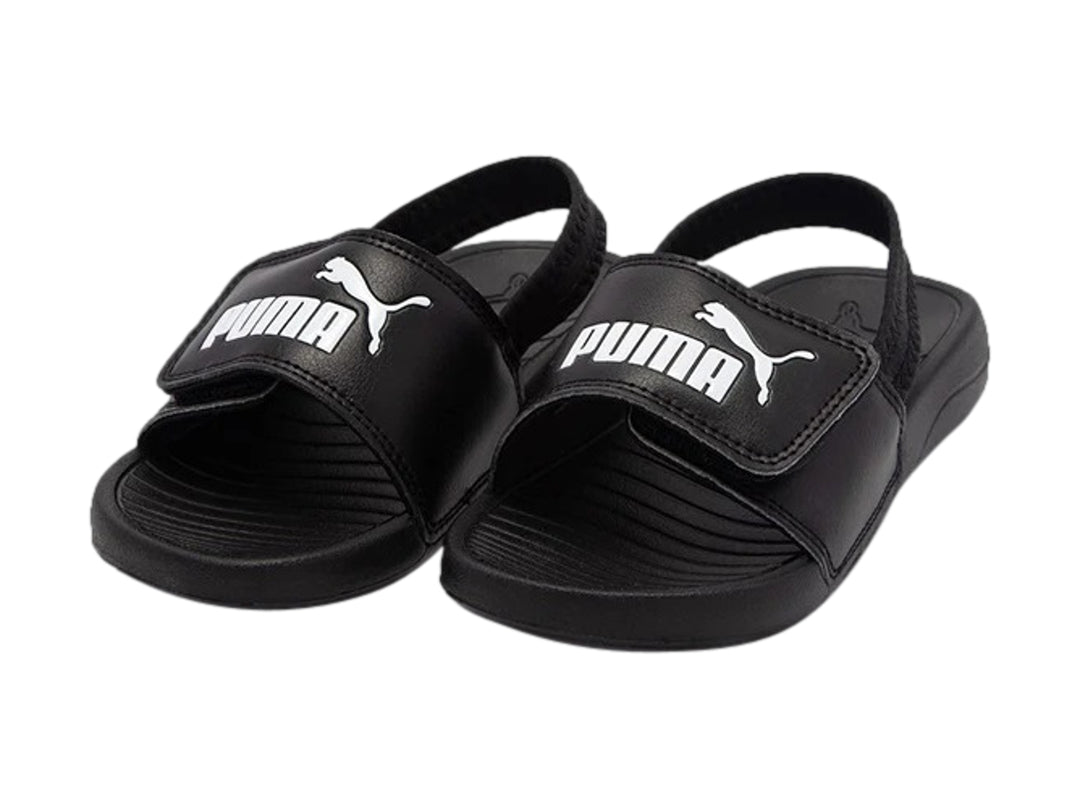 Sandalia Puma Popcat 20 negra para niño con correa posterior y logotipo blanco.