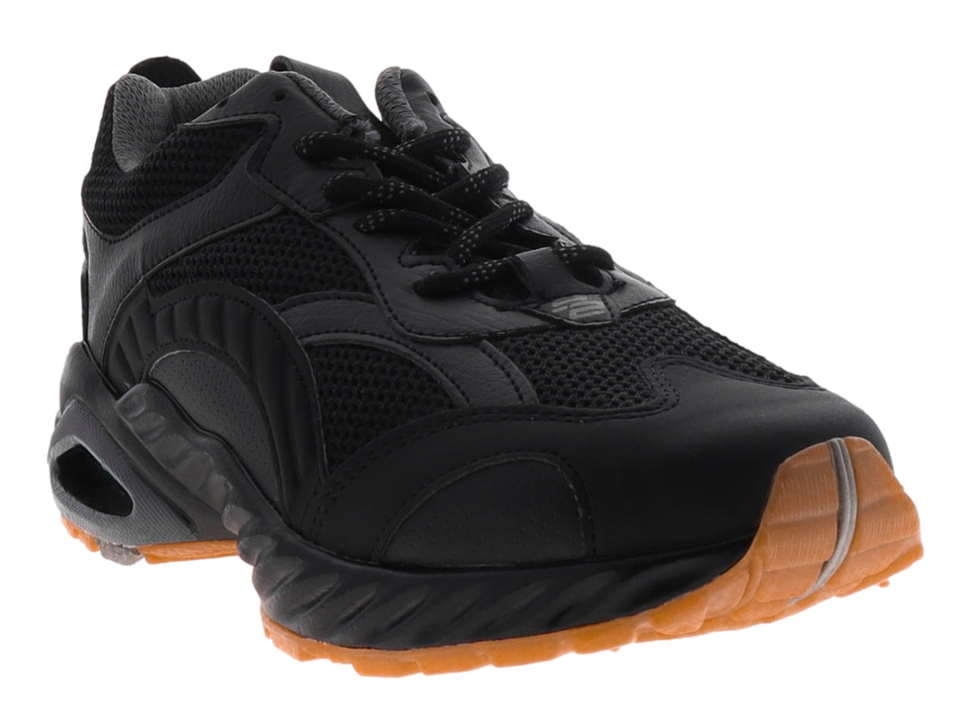 Tenis de baloncesto Pontiac AXL color negro con detalles en la suela color naranja y cámara de aire visible.