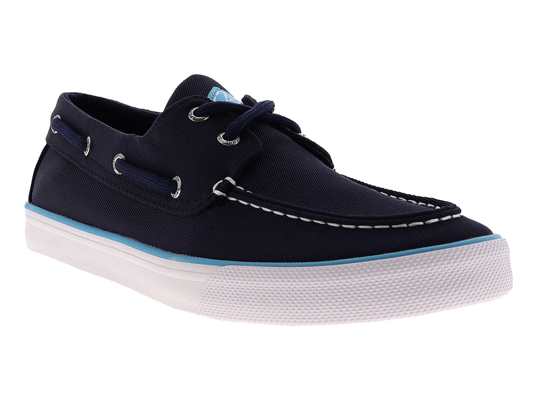 Zapato náutico Sperry de color azul marino con suela blanca y un detalle en azul claro.