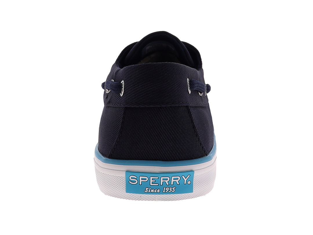 Zapato náutico Sperry de color azul marino con suela blanca y un detalle en azul claro.