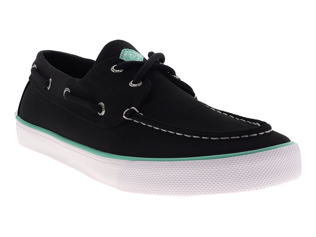 Zapato náutico Sperry color negro con suela blanca y detalle en verde menta, estilo casual.