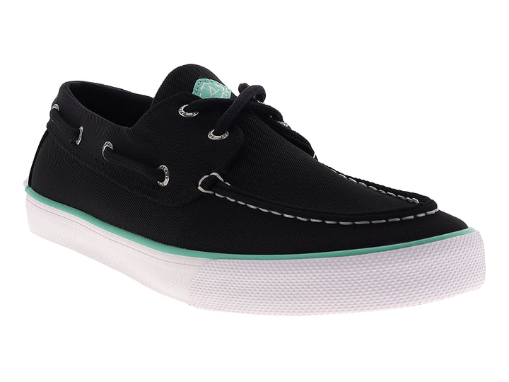 Zapato náutico Sperry color negro con suela blanca y detalle en verde menta, estilo casual.