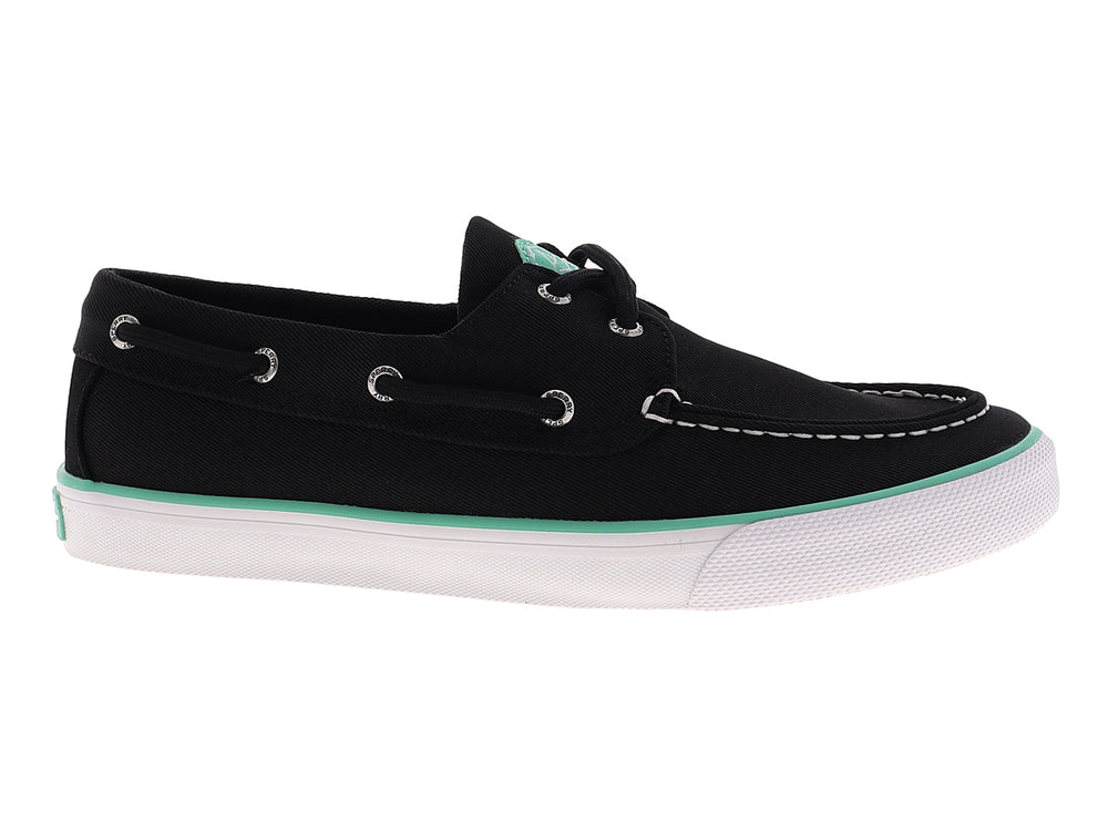 Zapato náutico Sperry color negro con suela blanca y detalle en verde menta, estilo casual.