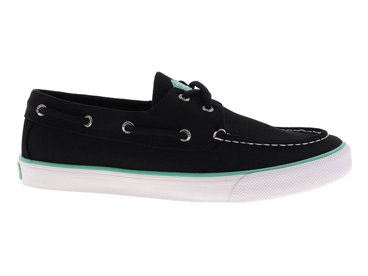 Zapato náutico Sperry color negro con suela blanca y detalle en verde menta, estilo casual.