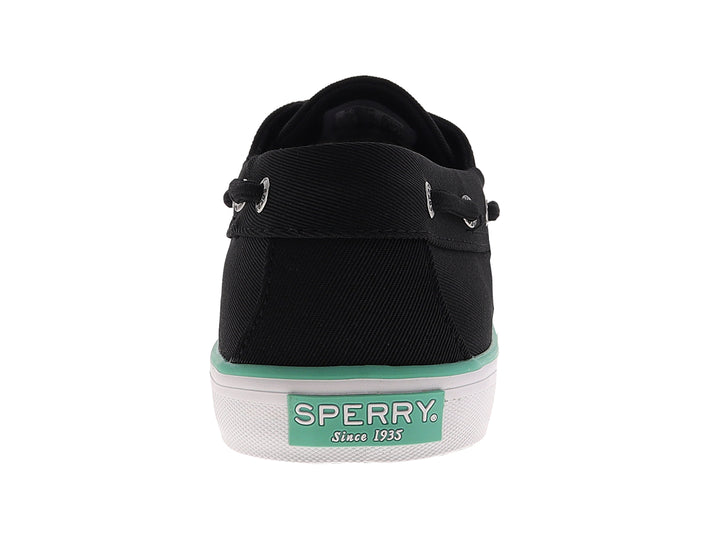 Zapato náutico Sperry color negro con suela blanca y detalle en verde menta, estilo casual.
