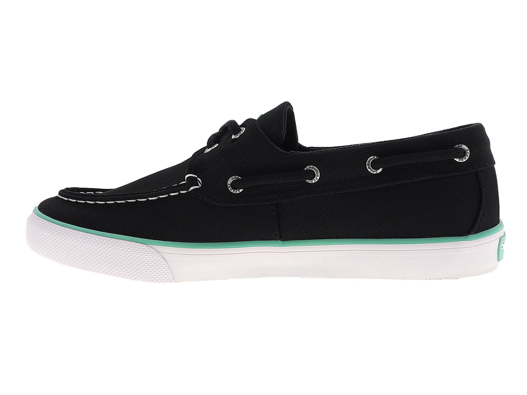 Zapato náutico Sperry color negro con suela blanca y detalle en verde menta, estilo casual.