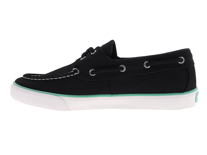 Zapato náutico Sperry color negro con suela blanca y detalle en verde menta, estilo casual.