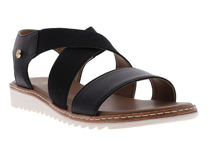 Sandalia casual para mujer de color negro con tiras cruzadas y suela blanca.