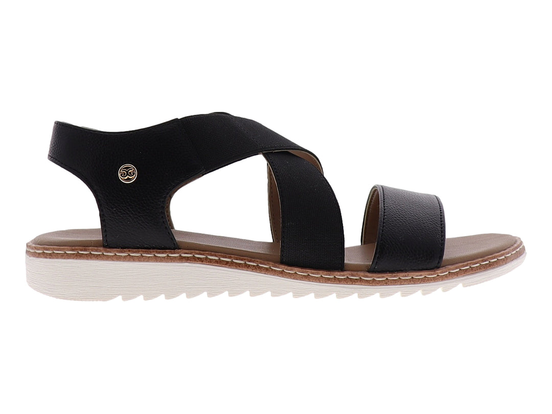 Sandalia casual para mujer de color negro con tiras cruzadas y suela blanca.