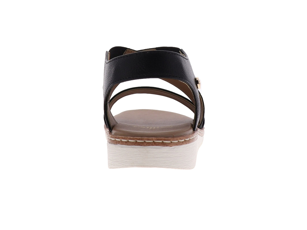 Sandalia casual para mujer de color negro con tiras cruzadas y suela blanca.