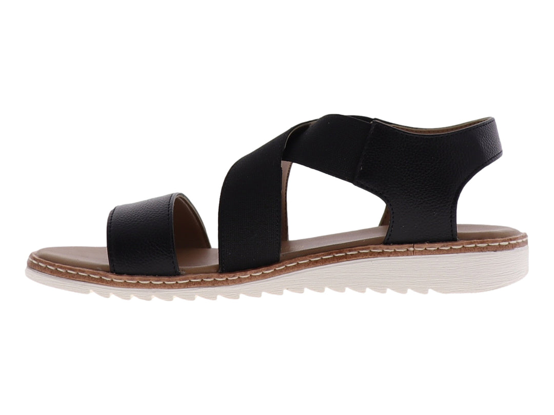 Sandalia casual para mujer de color negro con tiras cruzadas y suela blanca.