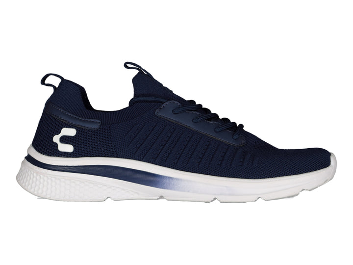 Tenis deportivos Charly color azul marino con suela blanca.
