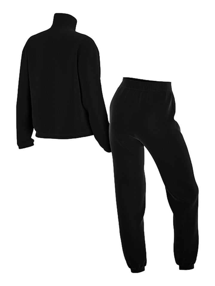 Conjunto deportivo Nike para mujer en color negro, compuesto por chaqueta y pantalón