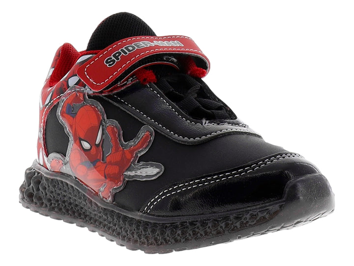 Tenis deportivos infantiles color negro con gráfico de Spider-Man y correa roja de velcro.