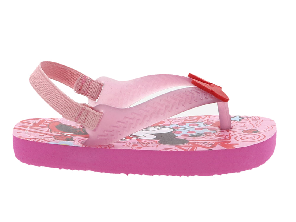 Sandalia rosa para niña con estampado de Minnie Mouse, moño rojo decorativo y correa trasera ajustable.