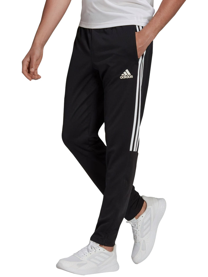 Pantalones deportivos Adidas color negro con tres franjas blancas laterales.